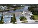 A neighborhood featuring waterfront homes, each with private boat docks and manicured lawns at 5413 Wishing Arch Dr, Apollo Beach, FL 33572