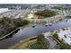 Waterfront home with private dock offers boat access, screened lanai, and scenic water views at 5413 Wishing Arch Dr, Apollo Beach, FL 33572