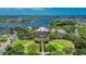 Gorgeous aerial view of a waterfront community with scenic views and luxury homes nestled among green landscaping at 5413 Wishing Arch Dr, Apollo Beach, FL 33572