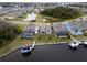 Waterfront properties, screened in pools, and private docks are featured in this aerial view at 5413 Wishing Arch Dr, Apollo Beach, FL 33572