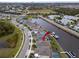 Aerial view showing waterfront property, private dock, and community's scenic waterways at 5413 Wishing Arch Dr, Apollo Beach, FL 33572