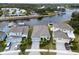 Aerial view of a charming neighborhood with waterfront homes and well-maintained landscaping at 5413 Wishing Arch Dr, Apollo Beach, FL 33572