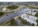 Waterfront homes with docks and boat lifts situated on a canal in a residential neighborhood at 5413 Wishing Arch Dr, Apollo Beach, FL 33572