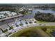 Aerial view of houses on waterfront with a boat dock and community amenities at 5413 Wishing Arch Dr, Apollo Beach, FL 33572