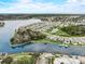 Expansive aerial view of a waterfront community with winding canals, lakes, and lush landscaping at 5413 Wishing Arch Dr, Apollo Beach, FL 33572