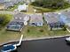 Aerial view of waterfront homes with screened in pools and private boat docks, offering a serene living experience at 5413 Wishing Arch Dr, Apollo Beach, FL 33572