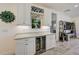 Elegant bar area with wine rack, beverage cooler, and a decorative piece at 5413 Wishing Arch Dr, Apollo Beach, FL 33572