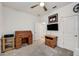 Bedroom with ceiling fan, neutral walls, a desk, and closet at 5413 Wishing Arch Dr, Apollo Beach, FL 33572