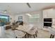 Open floor plan dining area with custom table, tile floors, and bright, natural light at 5413 Wishing Arch Dr, Apollo Beach, FL 33572