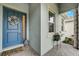 Inviting front door with a wreath, potted plants, and a welcoming entryway at 5413 Wishing Arch Dr, Apollo Beach, FL 33572
