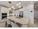Stylish kitchen featuring an island with pendant lighting, stainless steel appliances, and seating at 5413 Wishing Arch Dr, Apollo Beach, FL 33572