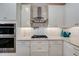 Kitchen with stainless steel appliances, stone countertops, and a gas stovetop at 5413 Wishing Arch Dr, Apollo Beach, FL 33572