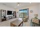Comfortable living room area with large TV and relaxing view of the water at 5413 Wishing Arch Dr, Apollo Beach, FL 33572