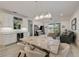 Open concept living and dining area featuring a bar and plenty of seating at 5413 Wishing Arch Dr, Apollo Beach, FL 33572