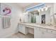 Sleek main bathroom with double sinks, a large vanity, and a separate glass-enclosed shower at 5413 Wishing Arch Dr, Apollo Beach, FL 33572