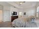 Spacious main bedroom featuring tray ceilings, a ceiling fan, and an ensuite bathroom at 5413 Wishing Arch Dr, Apollo Beach, FL 33572