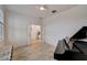 Sunlit piano room with a black grand piano near doorways and beautiful wood floors at 5413 Wishing Arch Dr, Apollo Beach, FL 33572