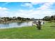 Picturesque waterfront view featuring a canal, private dock, and mature landscaping, perfect for boating enthusiasts at 5413 Wishing Arch Dr, Apollo Beach, FL 33572