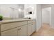 Bathroom vanity features double sinks, quartz countertop, and a walk-in closet at 5613 Kingsley Corner Way, Lithia, FL 33547