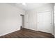 Open bedroom featuring a ceiling fan, wood floors, and closet at 5613 Kingsley Corner Way, Lithia, FL 33547