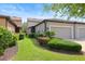 Well-maintained townhome with manicured landscaping and attached one-car garage at 5613 Kingsley Corner Way, Lithia, FL 33547