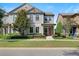 Charming two-story home with well-manicured lawn and vibrant landscaping at 5613 Kingsley Corner Way, Lithia, FL 33547