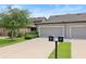 Charming townhome with attached garages and lush landscaping for added curb appeal at 5613 Kingsley Corner Way, Lithia, FL 33547