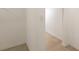 Bright hallway with neutral walls, trim, and flooring at 5613 Kingsley Corner Way, Lithia, FL 33547