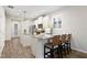 Kitchen with white cabinets, granite counters, stainless steel appliances and modern fixtures at 5613 Kingsley Corner Way, Lithia, FL 33547
