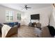 Open living room boasts recessed lighting, a ceiling fan, and wood-look tile flooring at 5613 Kingsley Corner Way, Lithia, FL 33547