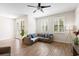 Cozy living room features recessed lighting, ceiling fan, and plantation shutters on the windows at 5613 Kingsley Corner Way, Lithia, FL 33547