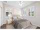 Serene main bedroom featuring plantation shutters, lamps, and a decorative painting at 5613 Kingsley Corner Way, Lithia, FL 33547