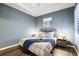 Comfortable main bedroom with wood-look floors and an elegant tray ceiling at 5613 Kingsley Corner Way, Lithia, FL 33547