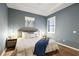 Comfortable main bedroom features wood-look floors, tray ceiling and plantation shutters at 5613 Kingsley Corner Way, Lithia, FL 33547