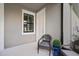Relaxing screened-in patio with wicker chairs and a view of the yard at 5613 Kingsley Corner Way, Lithia, FL 33547
