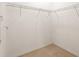 Spacious walk-in closet featuring wire shelving and neutral-toned flooring at 5613 Kingsley Corner Way, Lithia, FL 33547