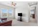 Bonus room with carpet, a ceiling fan, and natural light from two windows at 5717 Village Center Dr, Lithia, FL 33547