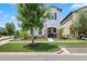 Beautifully landscaped front yard featuring a tidy lawn and attractive shrubbery at 5717 Village Center Dr, Lithia, FL 33547