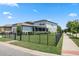 Well-maintained home with a large backyard, privacy fence, and lush landscaping at 5717 Village Center Dr, Lithia, FL 33547