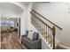 Open foyer with wood-look flooring, a staircase and a view into the living room at 5717 Village Center Dr, Lithia, FL 33547