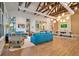 Open-concept living room features comfortable seating, a large table and plenty of light at 5717 Village Center Dr, Lithia, FL 33547