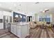 Spacious open floor plan with kitchen island and dining area view at 5717 Village Center Dr, Lithia, FL 33547