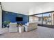 Enclosed outdoor patio area with comfortable seating, lighting, and view of the pool at 5717 Village Center Dr, Lithia, FL 33547