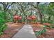 A mulched playground with charming wooden playhouses and slides at 5717 Village Center Dr, Lithia, FL 33547
