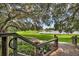 Scenic pond view from a wooden deck and stairs at 5717 Village Center Dr, Lithia, FL 33547