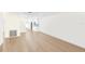 Open floor plan showing empty space with light wood flooring at 6025 Shore S Blvd # 409, Gulfport, FL 33707