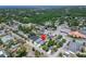 An aerial view of the home with the location pinpointed near a densely wooded area at 6097 Vermont Ave, New Port Richey, FL 34653