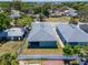 Aerial view of backyard with white privacy fence and freshly painted house at 6097 Vermont Ave, New Port Richey, FL 34653