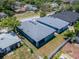 Aerial view of backyard with white privacy fence and freshly painted house at 6097 Vermont Ave, New Port Richey, FL 34653