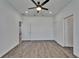 Bedroom featuring wood-look flooring and a doorway to another room at 6097 Vermont Ave, New Port Richey, FL 34653